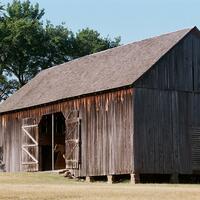 Argo, Jim, photographer. "Peter Conser Home." Photograph. 2006. From The Gateway to Oklahoma History. https://gateway.okhistory.org/ark:/67531/metadc1641283/m1/1/?q=barn (accessed January 9. 2024).