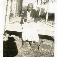 Photograph of Charlotte Johnson, age 88. She was a former slave and lived with Kizzie McNack, a church worker, four miles east of Ft. Gibson, OK. Courtesy of Oklahoma Historical Society.